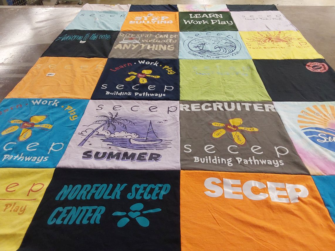 T-shirt quilt with education, career development themes by Janet from VA