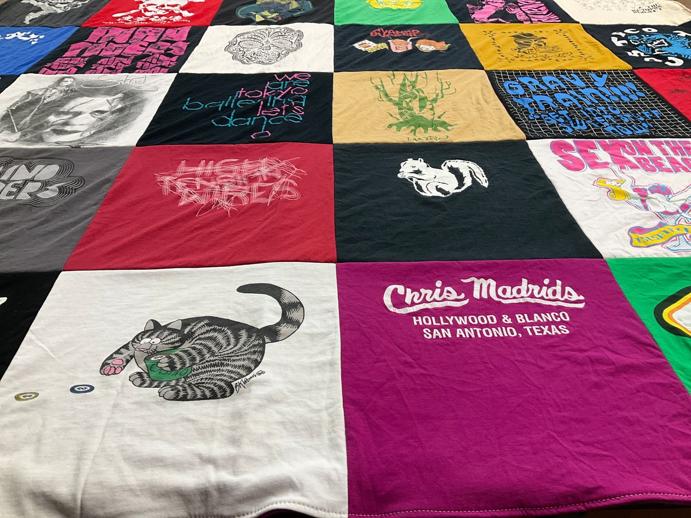 T-shirt quilt with art, music themes by Rita from TX