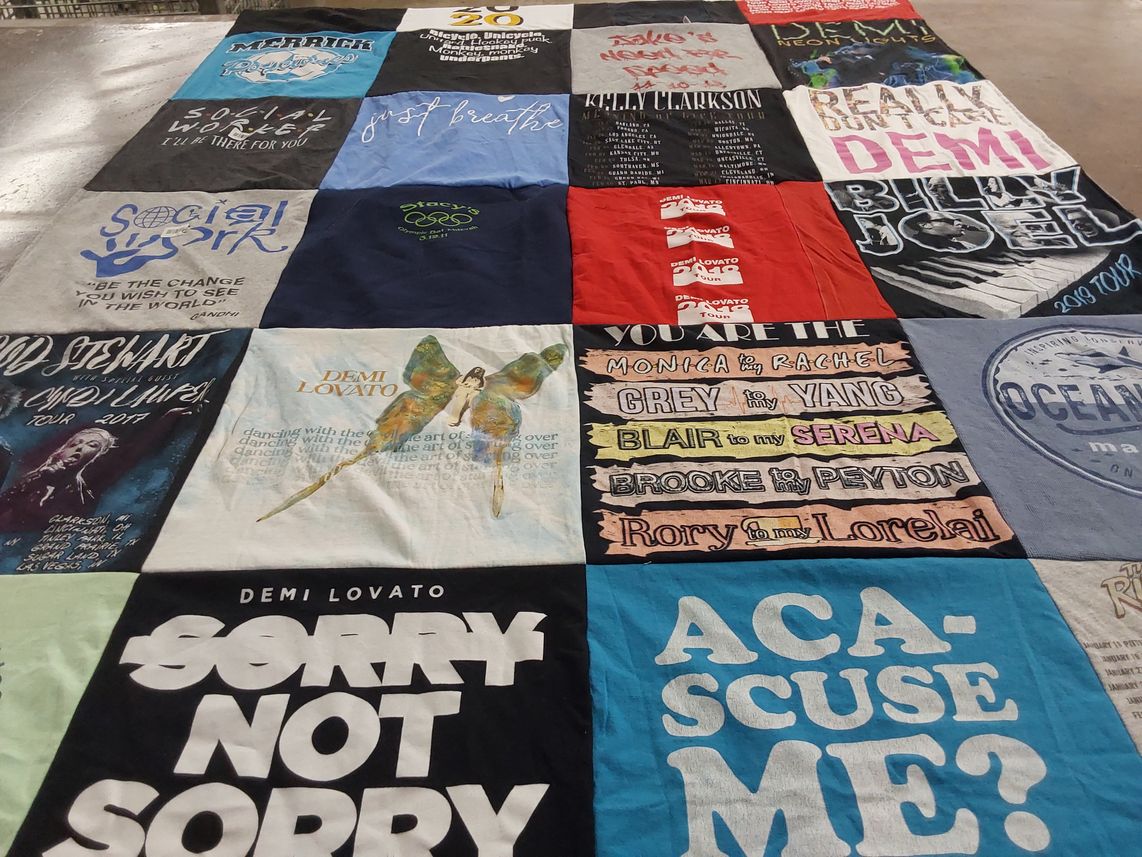 T-shirt quilt with music, social work themes by Lisa from NY