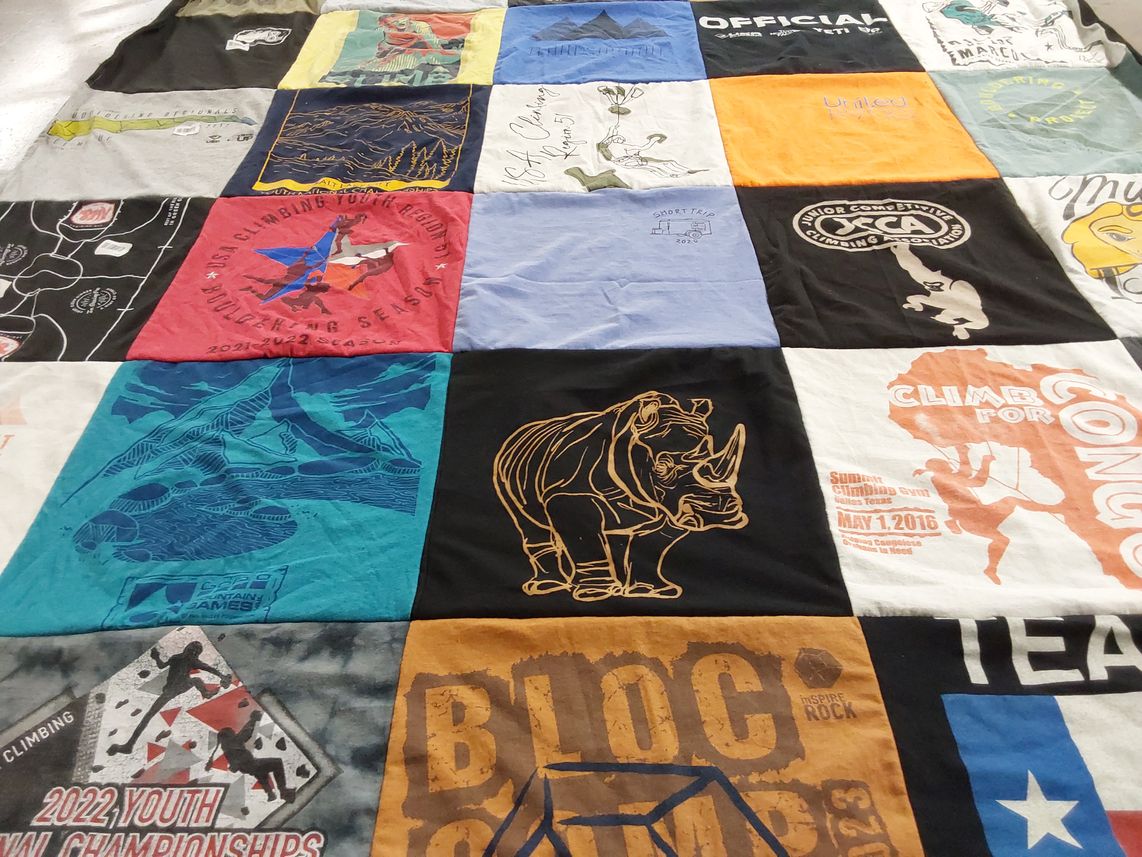 T-shirt quilt with climbing, sports themes by Doria from TX
