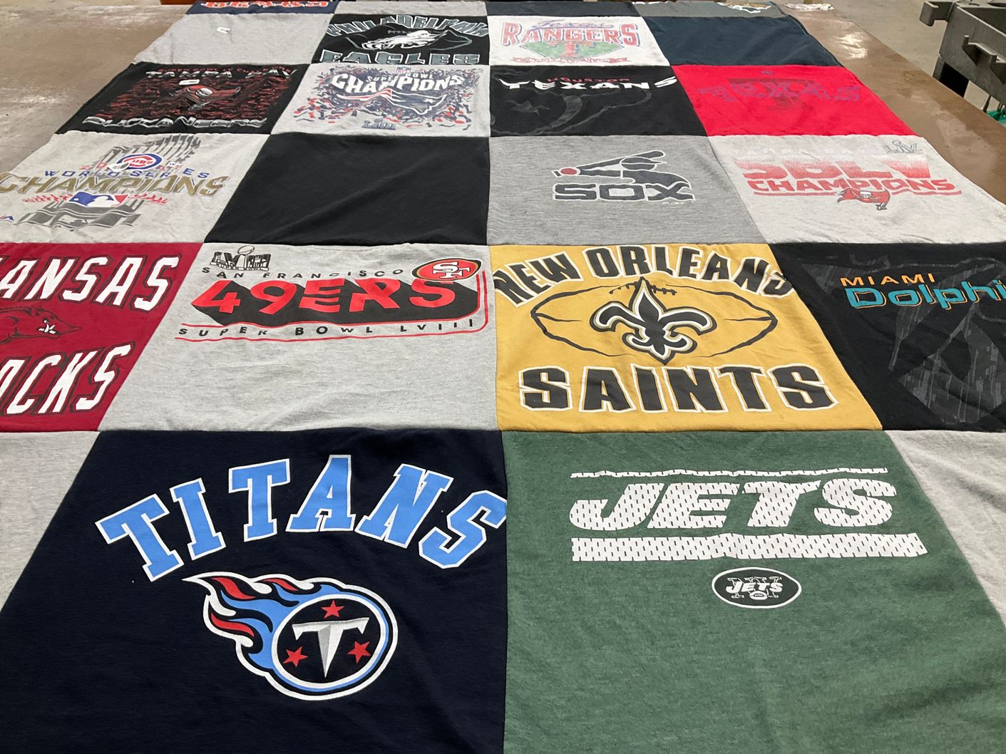 T-shirt quilt featuring new orleans saints, miami dolphins by Maryanne from IL