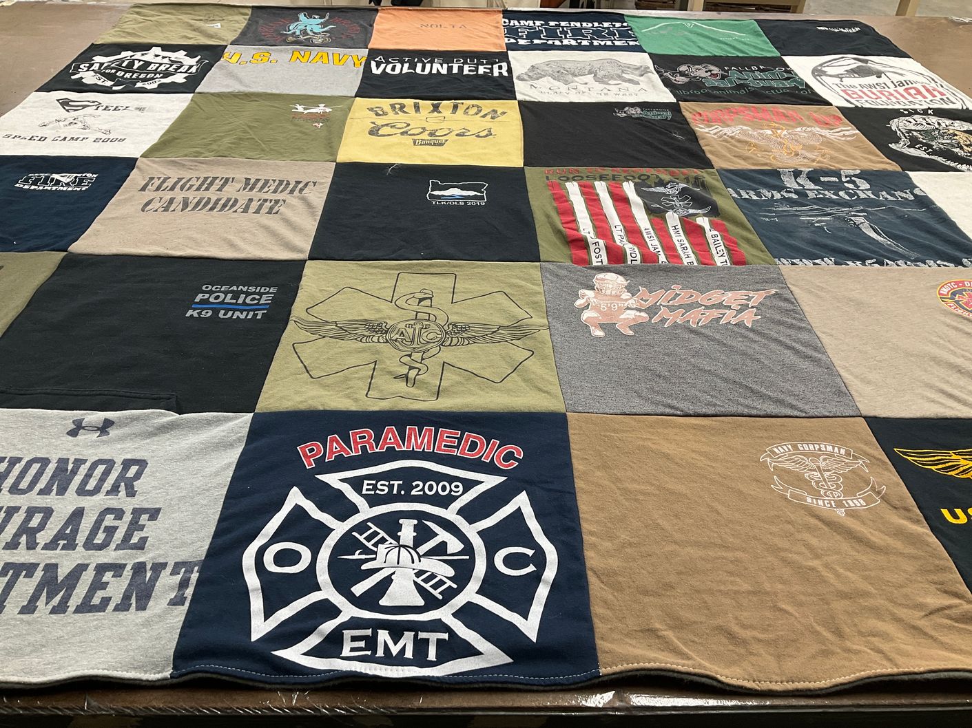 T-shirt quilt with emergency services, military themes by Emma from CA