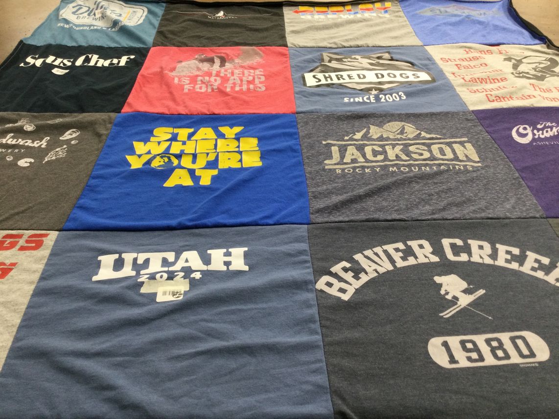 T-shirt quilt with skiing, brewing themes by Kim from SC