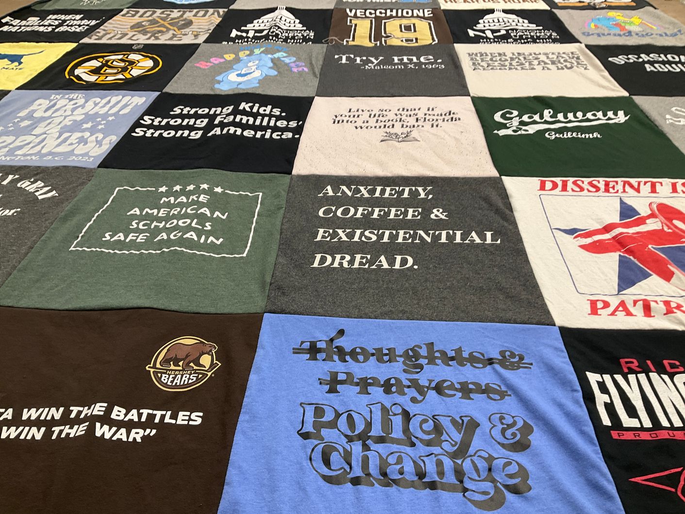 T-shirt quilt with education, activism themes by Emilie from PA