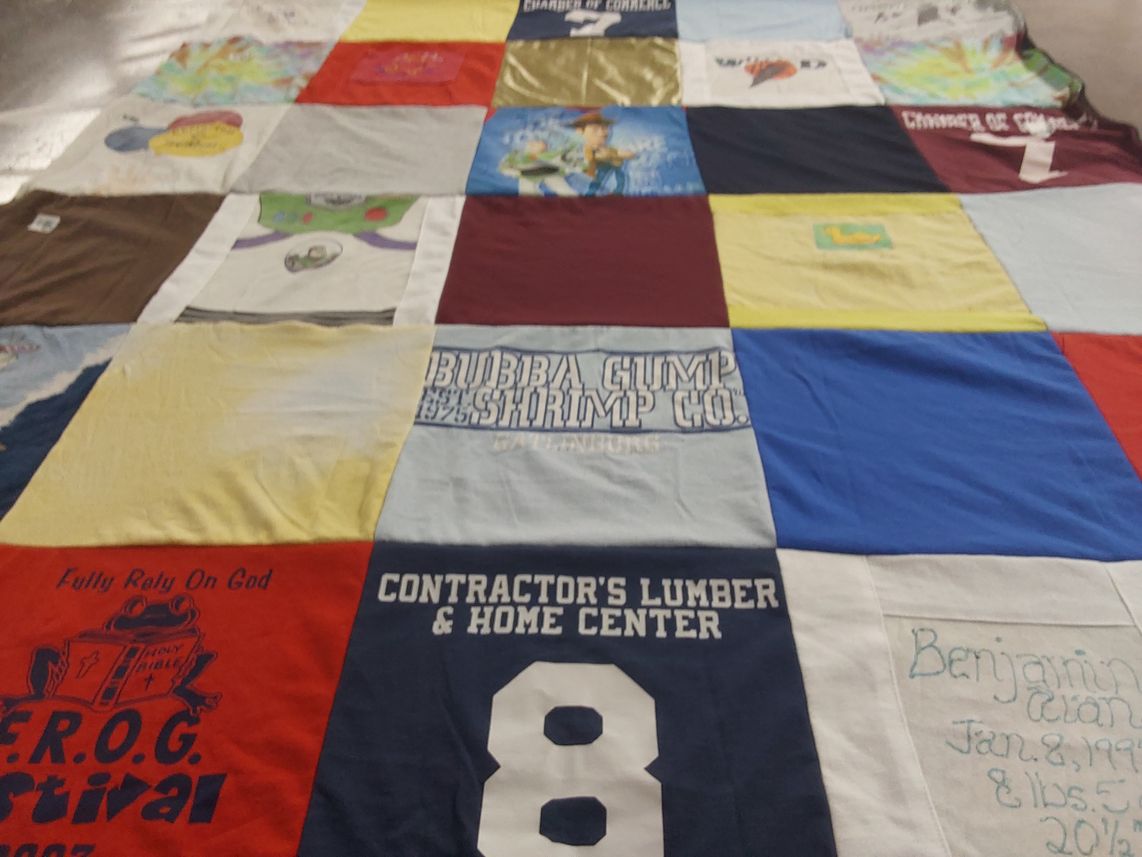 T-shirt quilt with family, community themes by Jennifer from OH