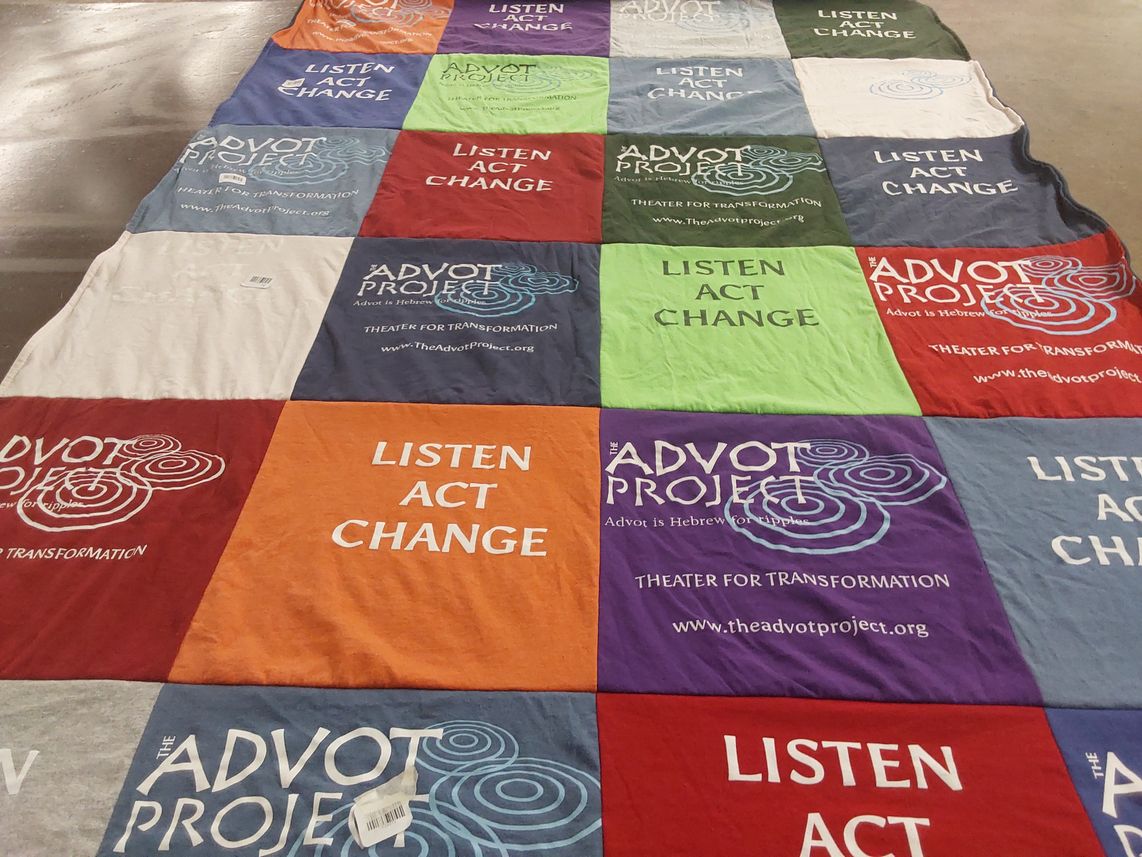 T-shirt quilt with theater, community engagement themes by Naomi from CA