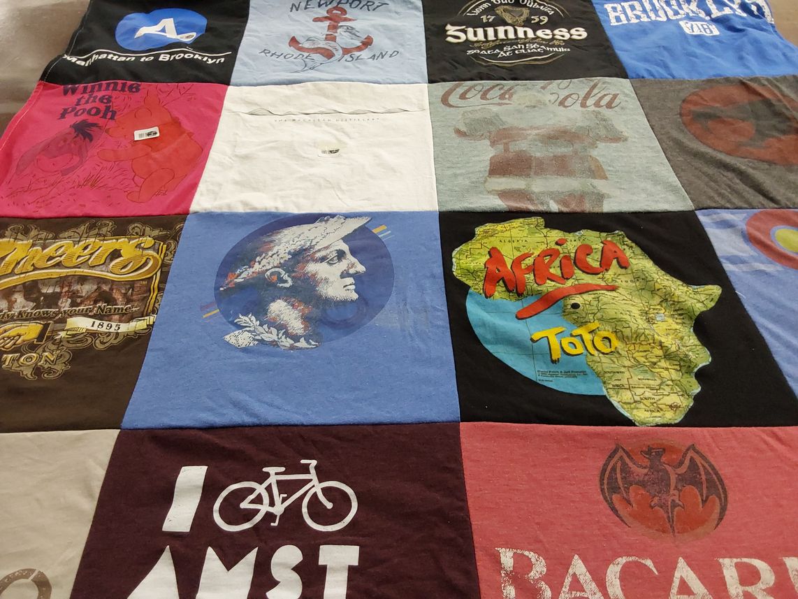 T-shirt quilt with travel, music themes by Florie from NY