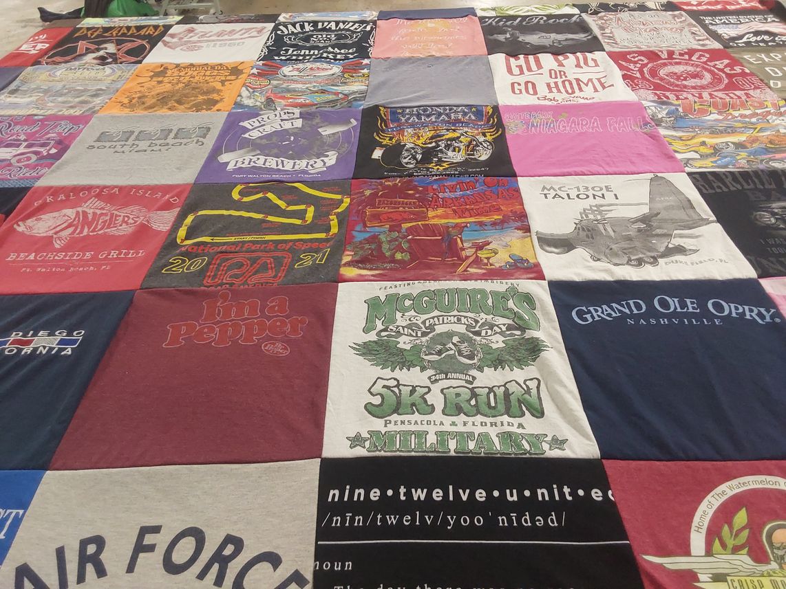 T-shirt quilt with hiking, music themes by Kelly from GA