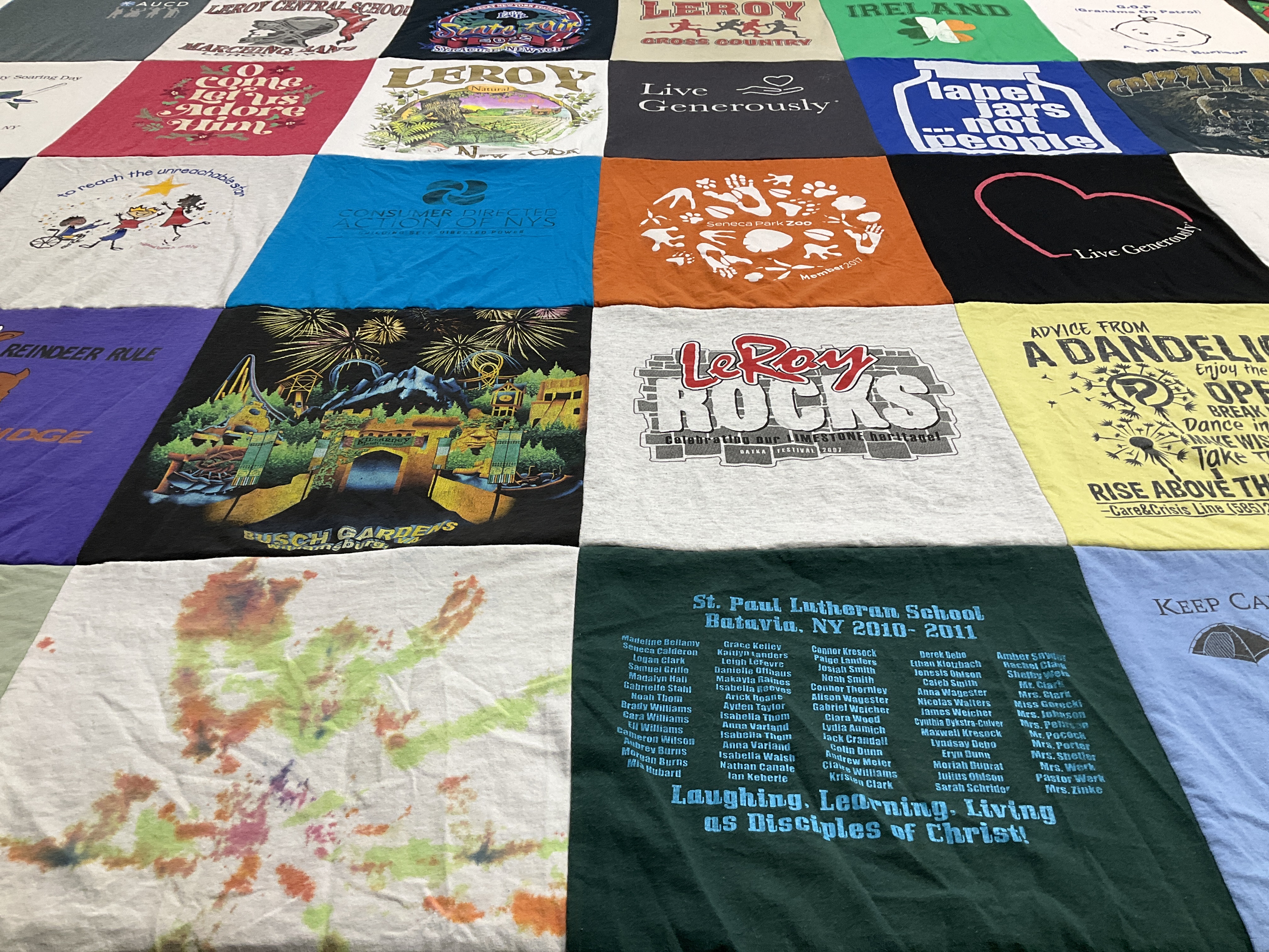 T-shirt quilt with community service, running themes by Ann from NY