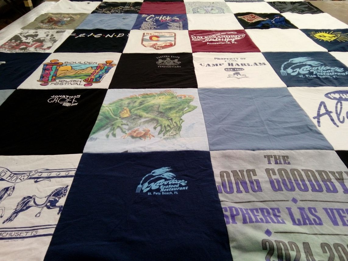 T-shirt quilt with theater, festivals themes by Lee from CO