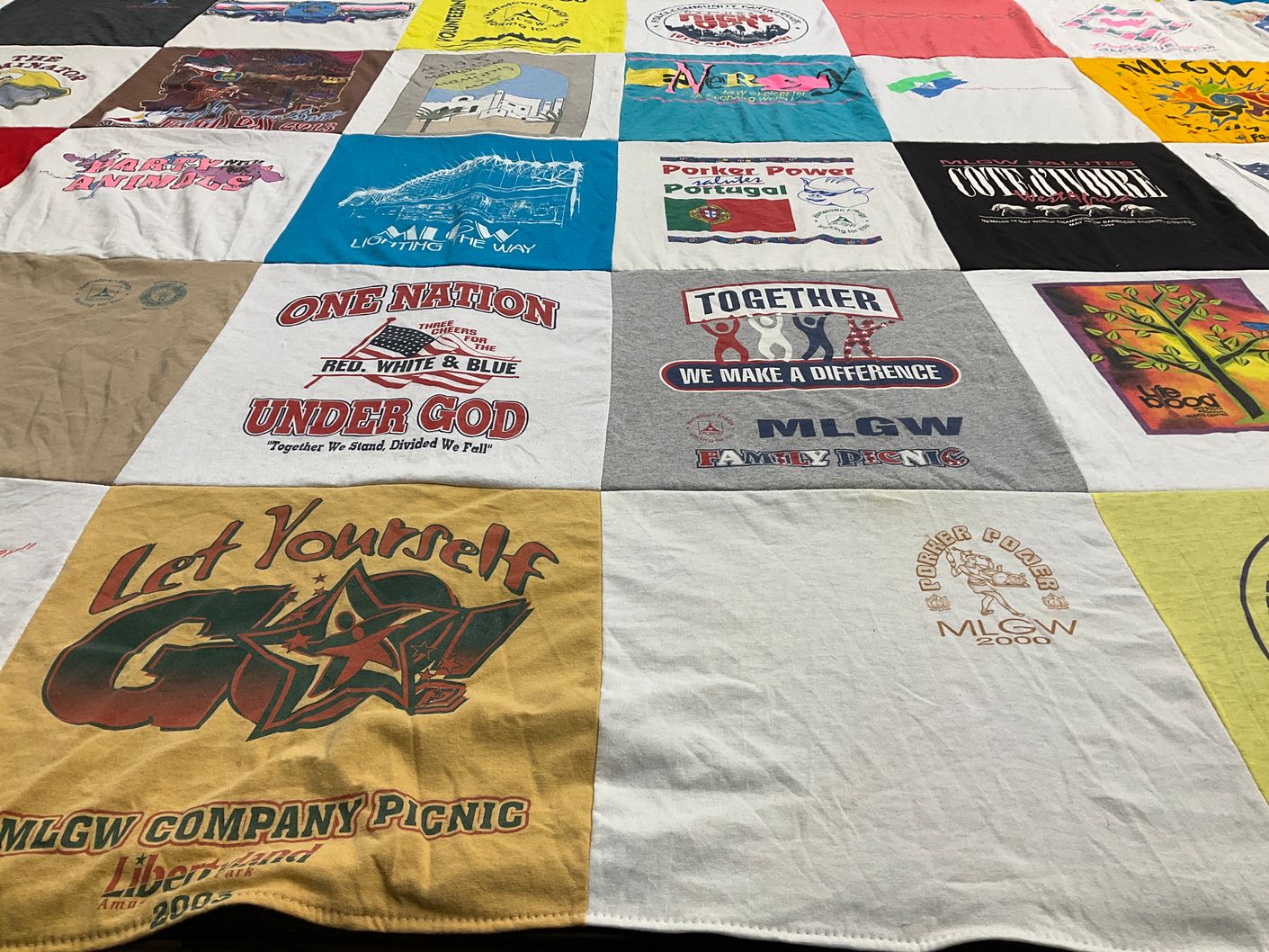 T-shirt quilt with community events, family gatherings themes by Elizabeth from MO