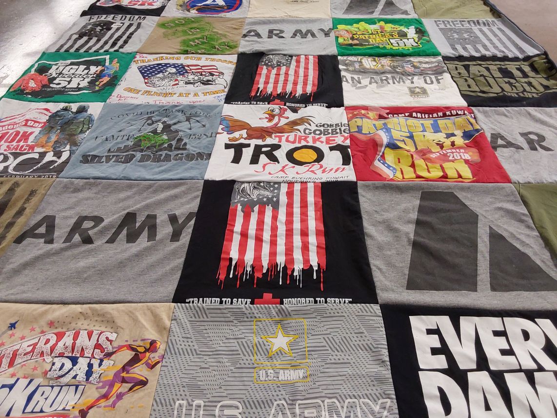 T-shirt quilt with military, running themes by Buddy from NC