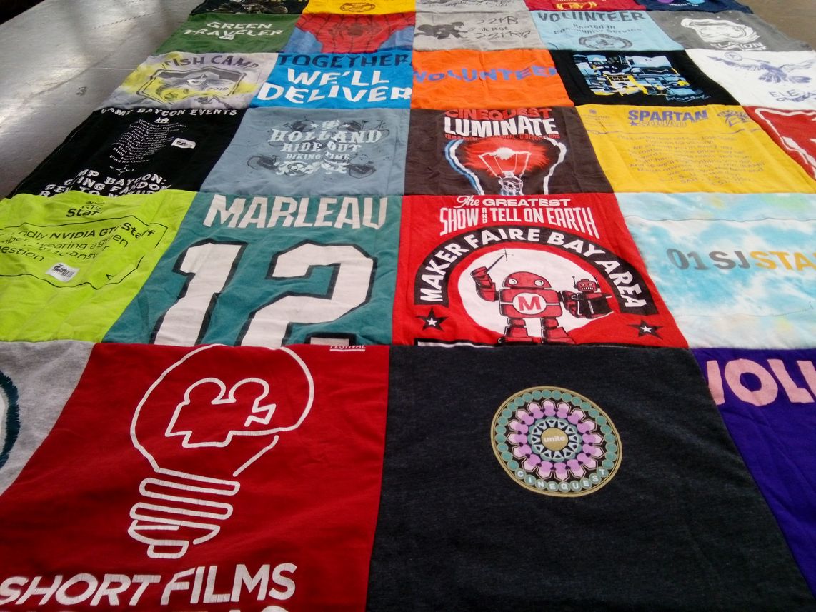 T-shirt quilt with volunteering, maker fairs themes by Linda  from CA