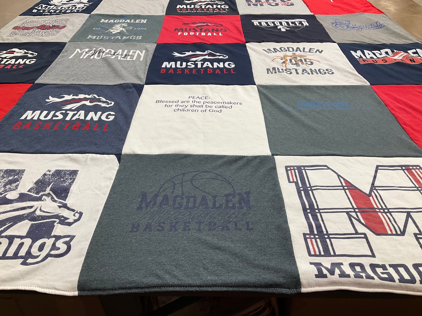 T-shirt quilt featuring magdalen mustangs basketball by LINDSAY from KS