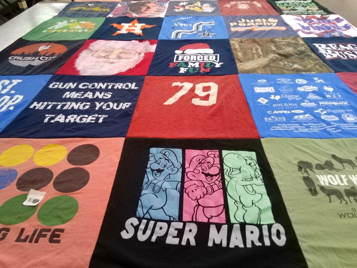 T-shirt quilt with gaming themes by Nancy Jane from TX