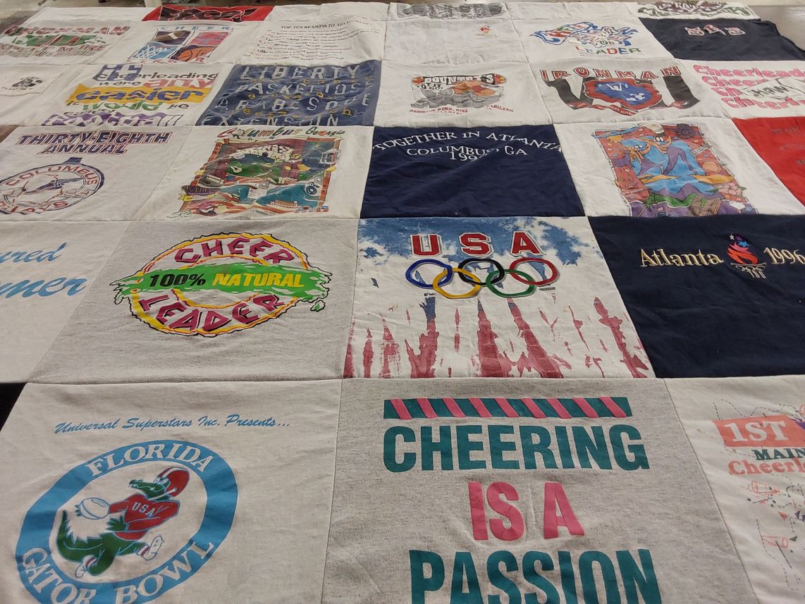 T-shirt quilt with cheerleading, sports themes by Crystal from GA
