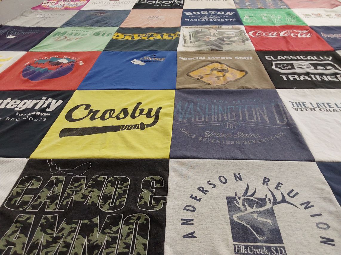 T-shirt quilt with travel, history themes by Rebekah from ND