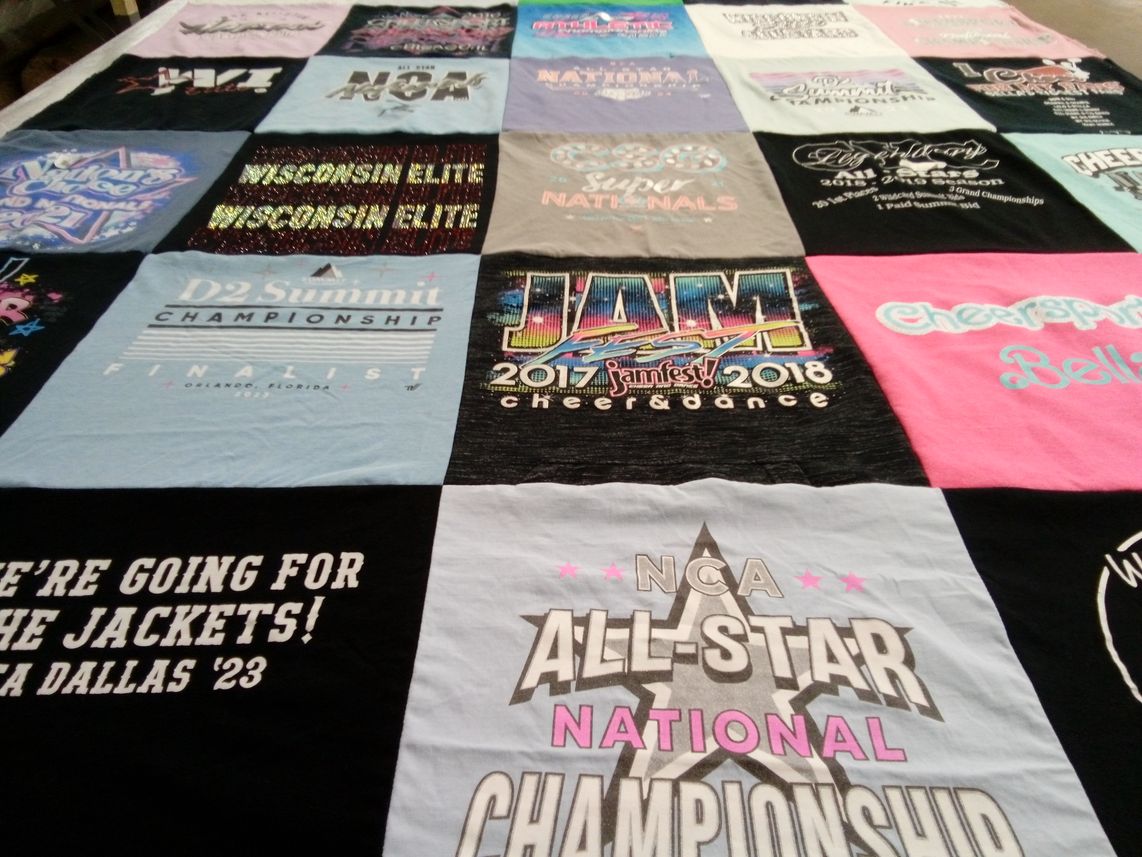 T-shirt quilt with cheerleading, dance themes by DELIA from WI