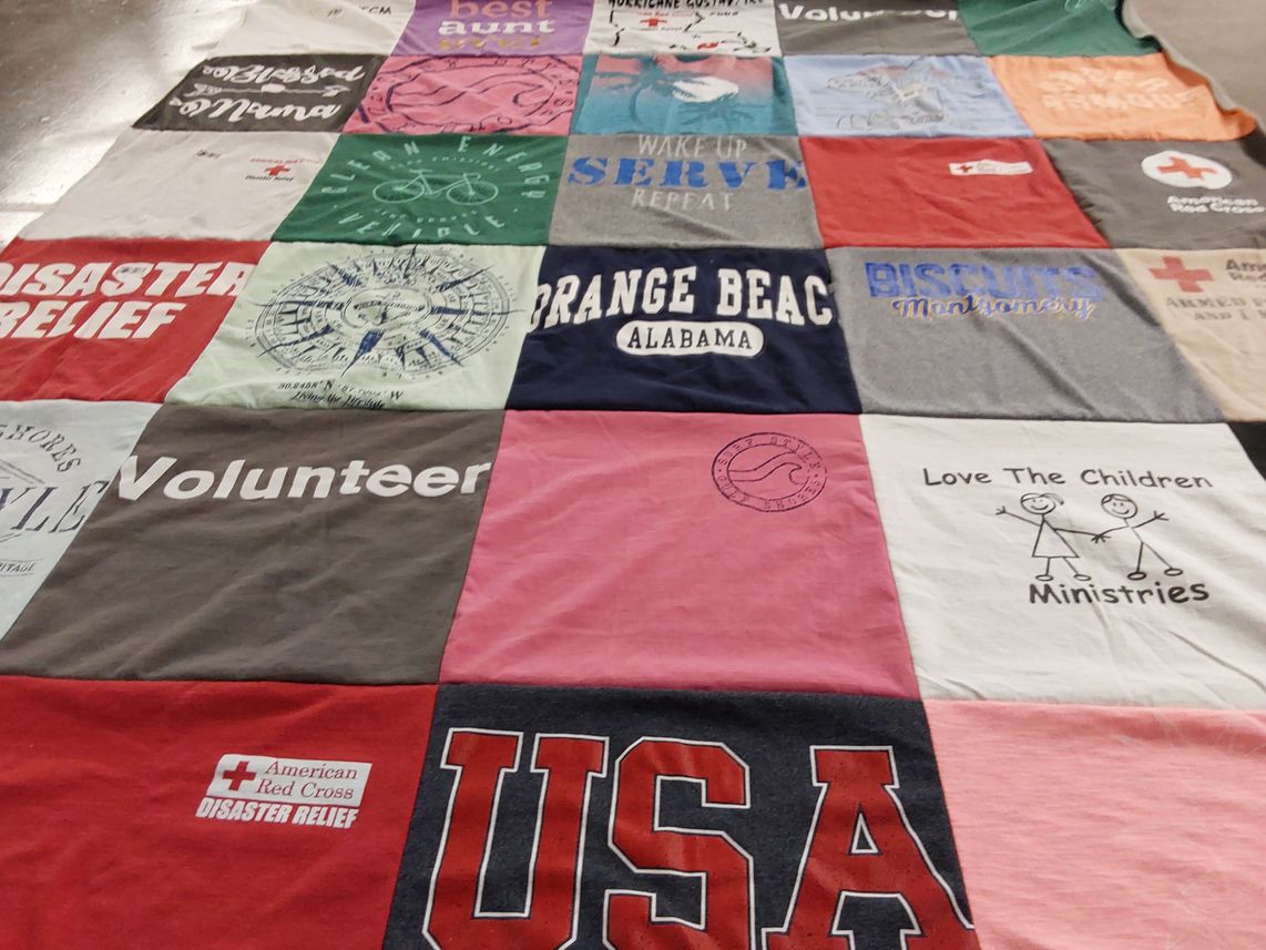 T-shirt quilt with volunteering, community service themes by Niki from AL