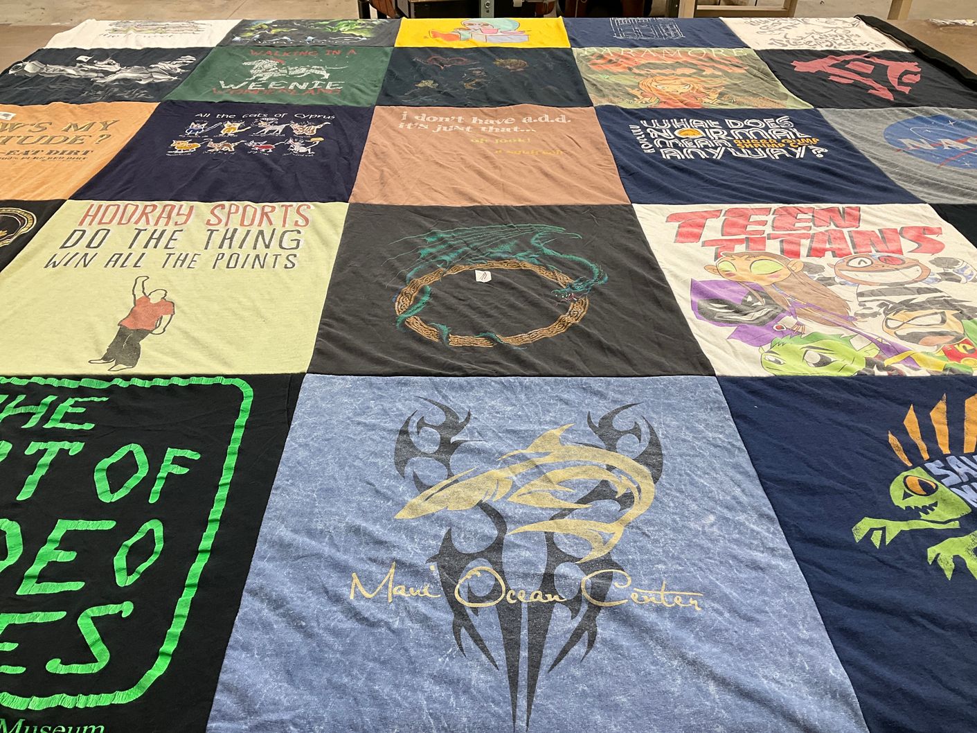 T-shirt quilt with comics, sports themes by Jennifer from FL