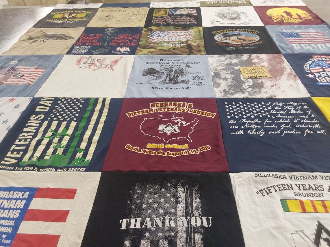 T-shirt quilt with military, veteran affairs themes by Marjorie from NE