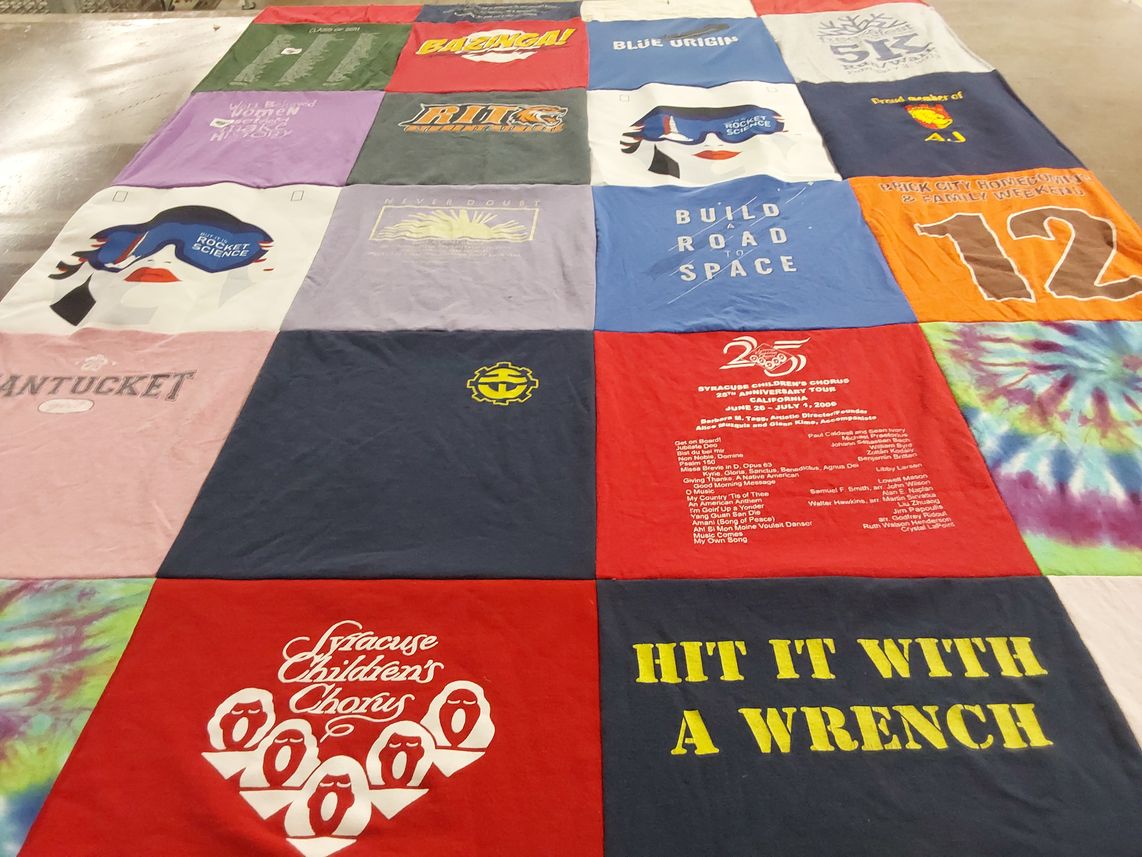 T-shirt quilt with science, music themes by Mary from CA