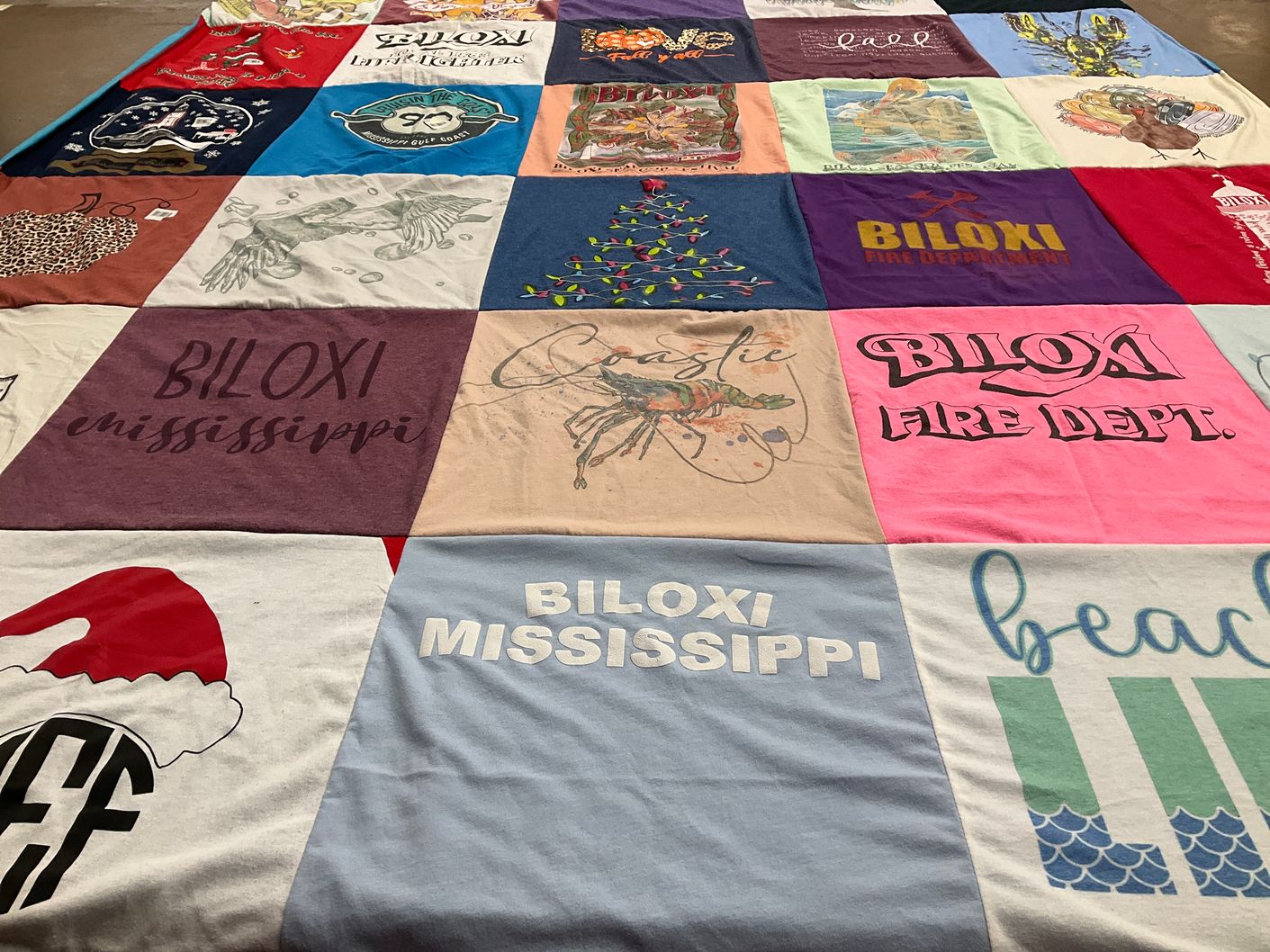T-shirt quilt with beaches, fire departments themes by Connie from MS