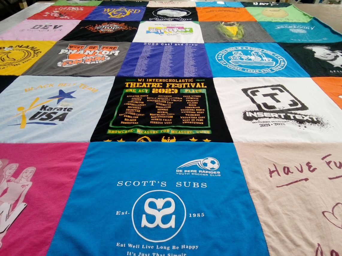 T-shirt quilt with theatre, karate themes by Meredith from WI