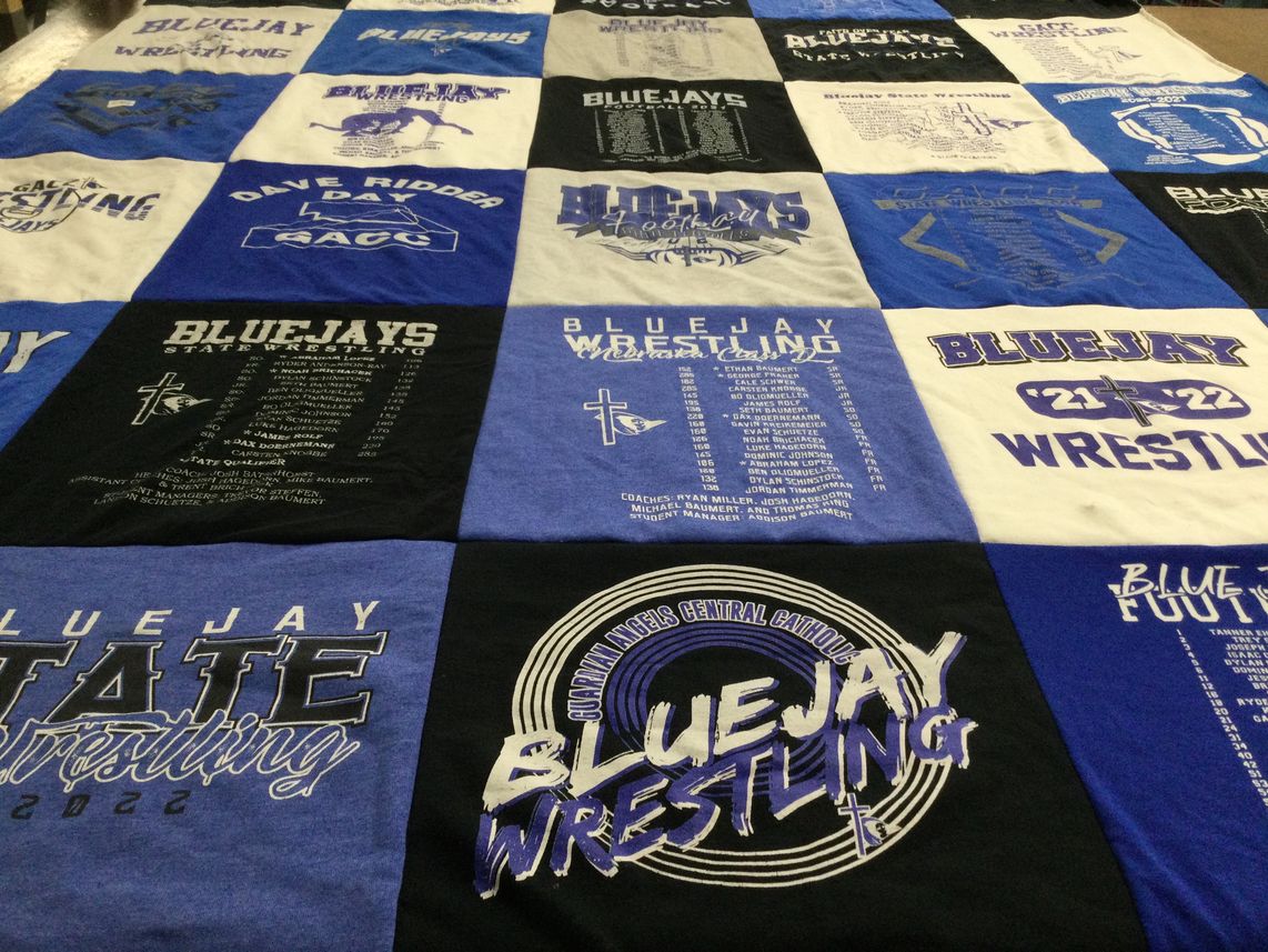 T-shirt quilt featuring bluejays wrestling by Lana from NE