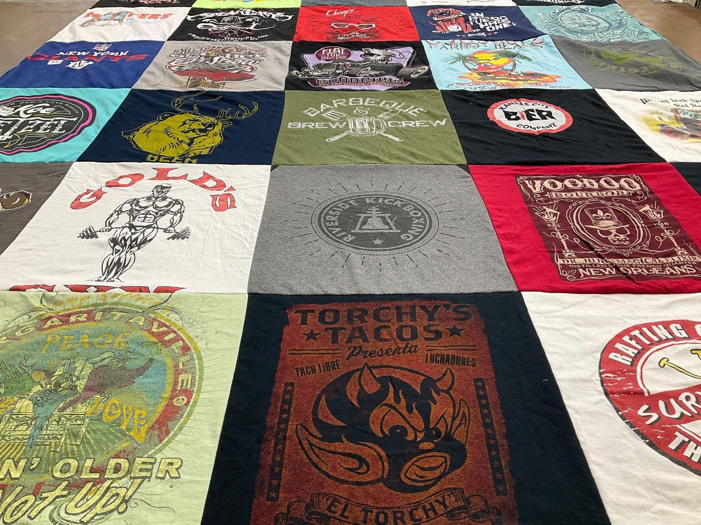T-shirt quilt with fitness, food themes by Brynn from TX
