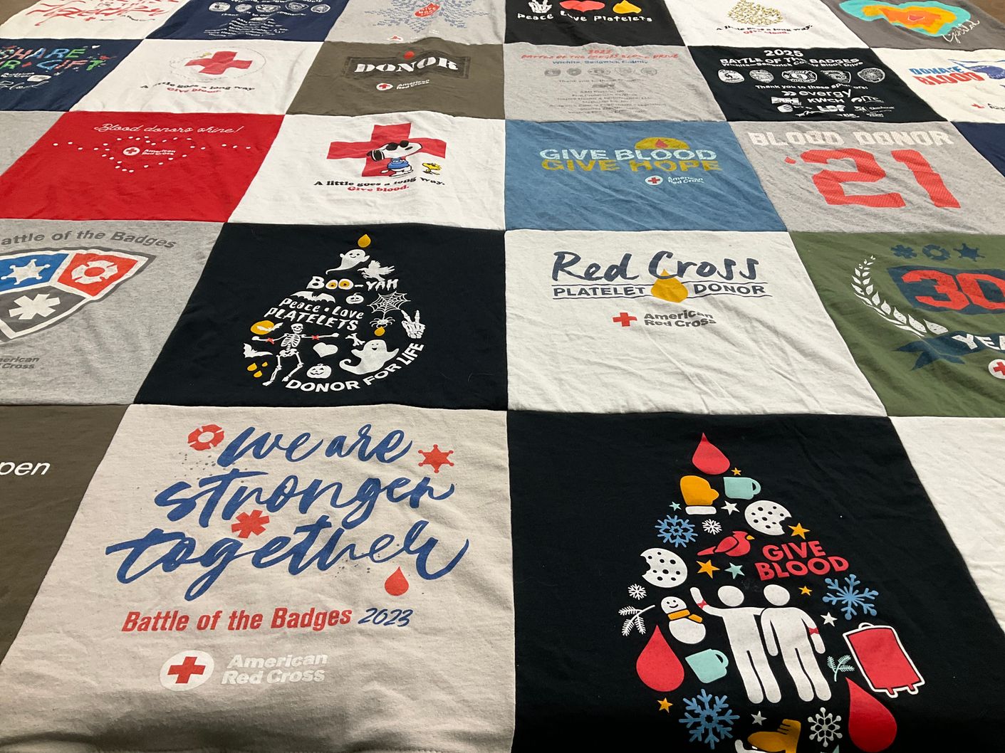 T-shirt quilt with blood donation, healthcare themes by Amy from KS