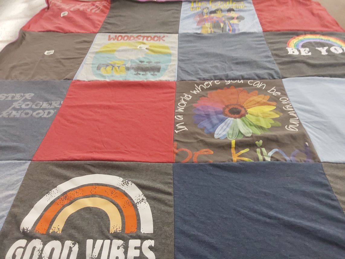 T-shirt quilt with positivity, music themes by Karen from WI