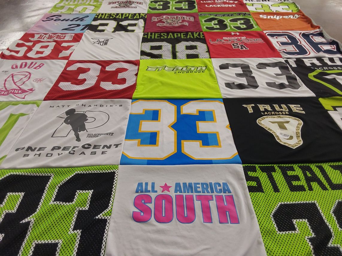 T-shirt quilt with lacrosse themes by Julie from FL
