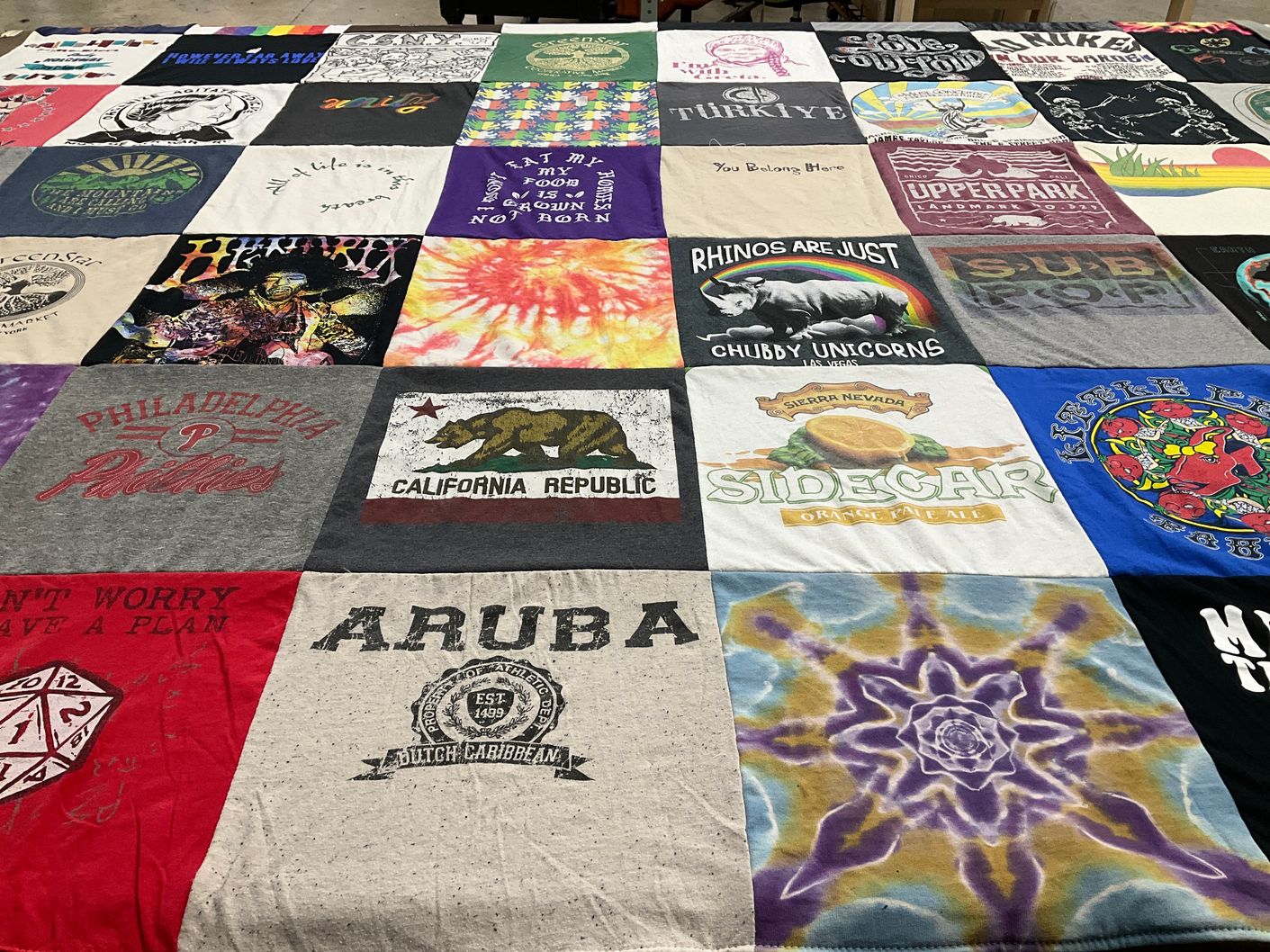 T-shirt quilt with travel, beer themes by Tami from CA