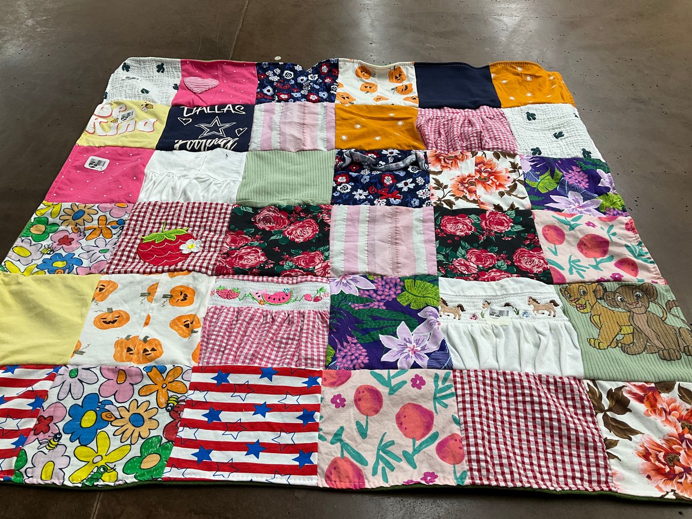 T-shirt quilt with floral designs, animals themes by Jennifer from TX