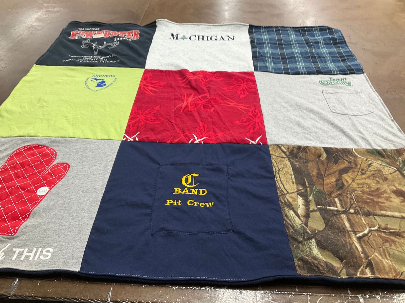 T-shirt quilt with hunting, fishing themes by Cathleen from MI