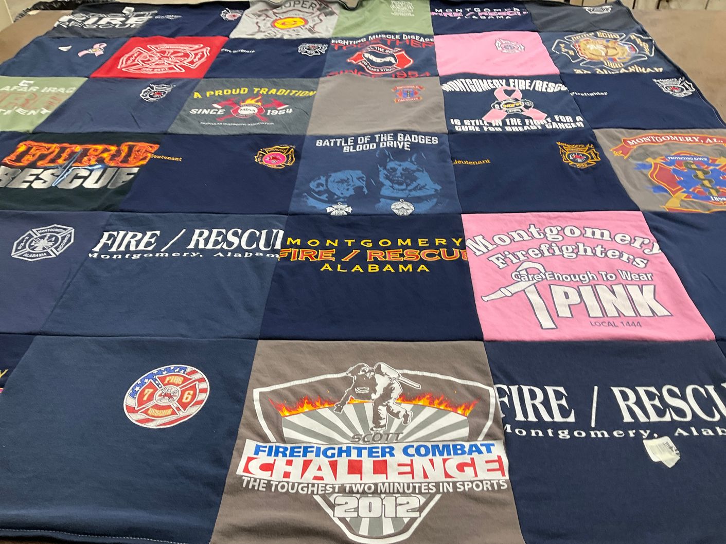 T-shirt quilt with firefighting, community service themes by Loraine from AL