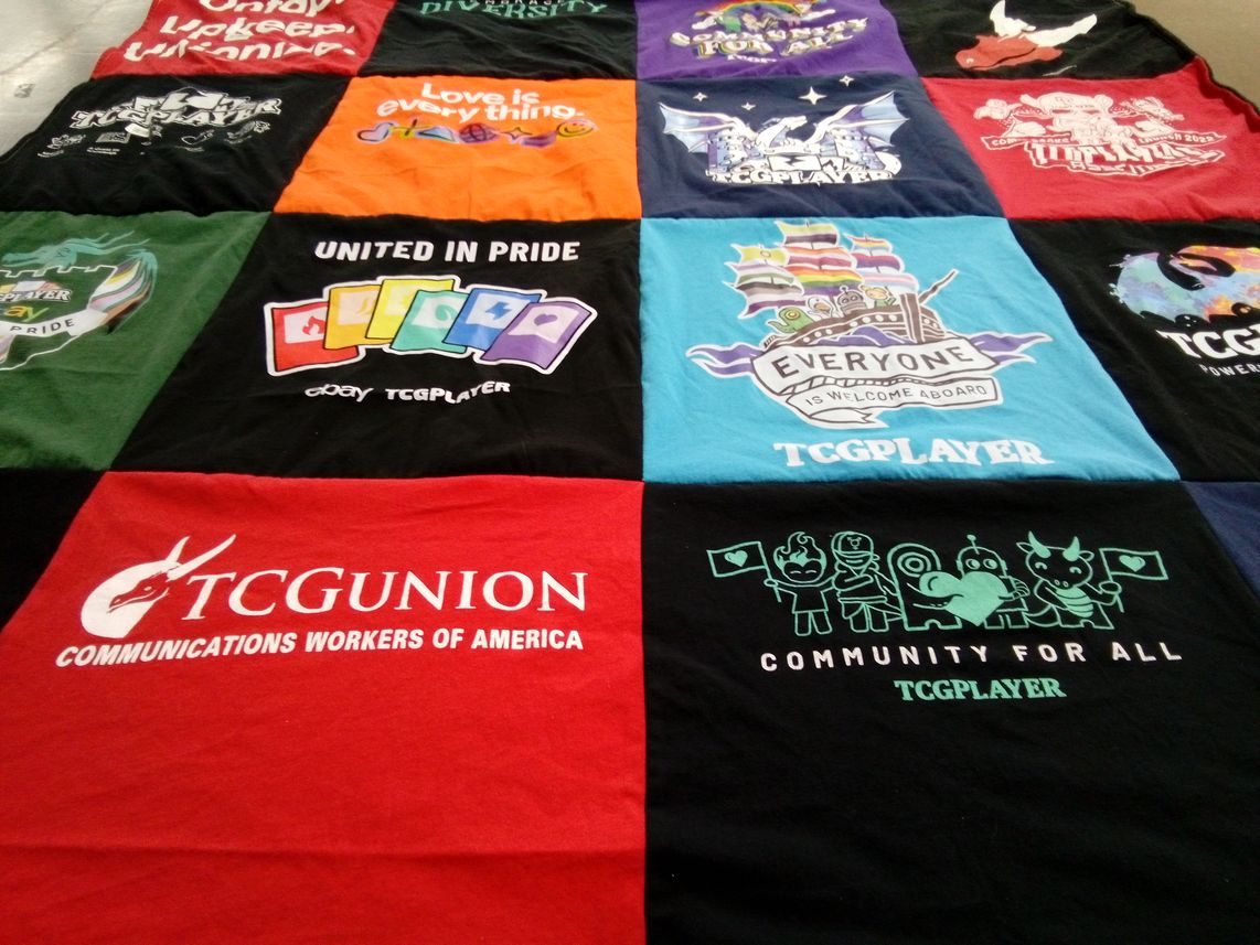T-shirt quilt with gaming, community building themes by Sarah from NY