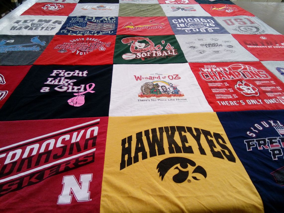 T-shirt quilt featuring nebraska corn huskers, iowa hawkeyes by Laura from SD