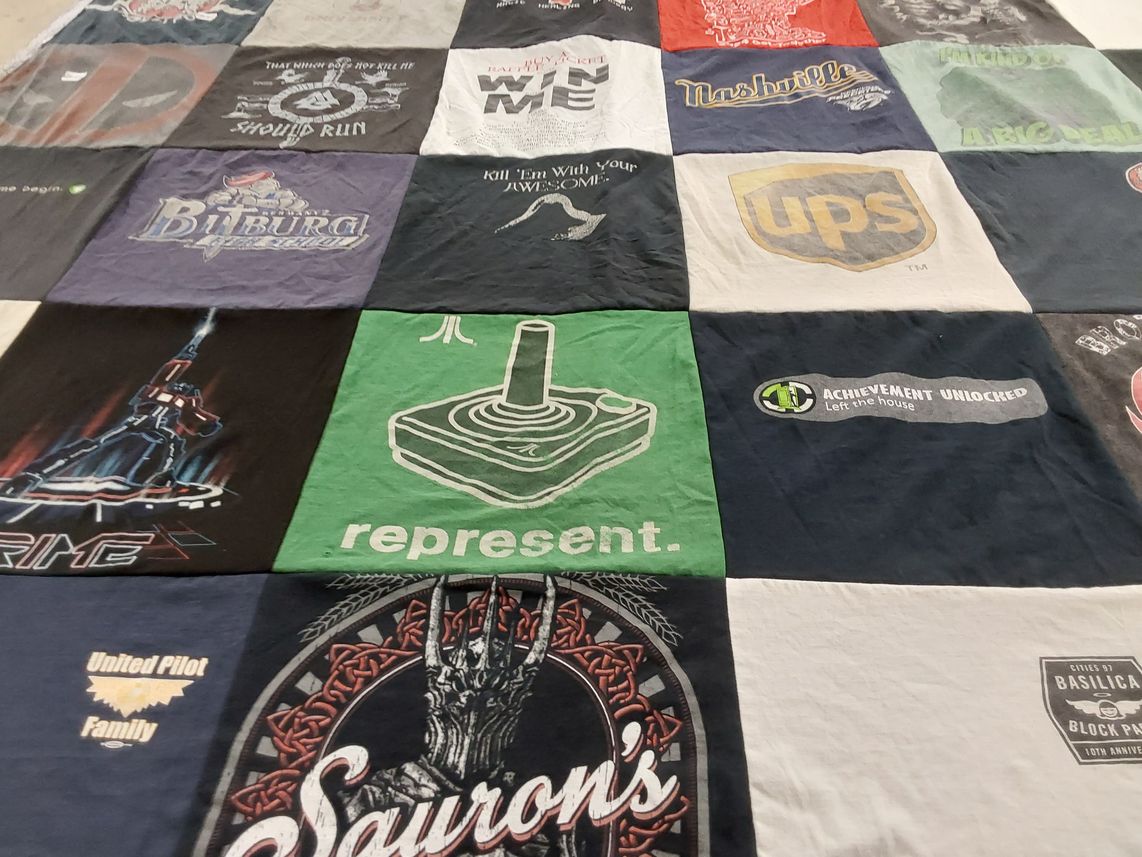 T-shirt quilt with gaming, tv shows themes by Margo from MN