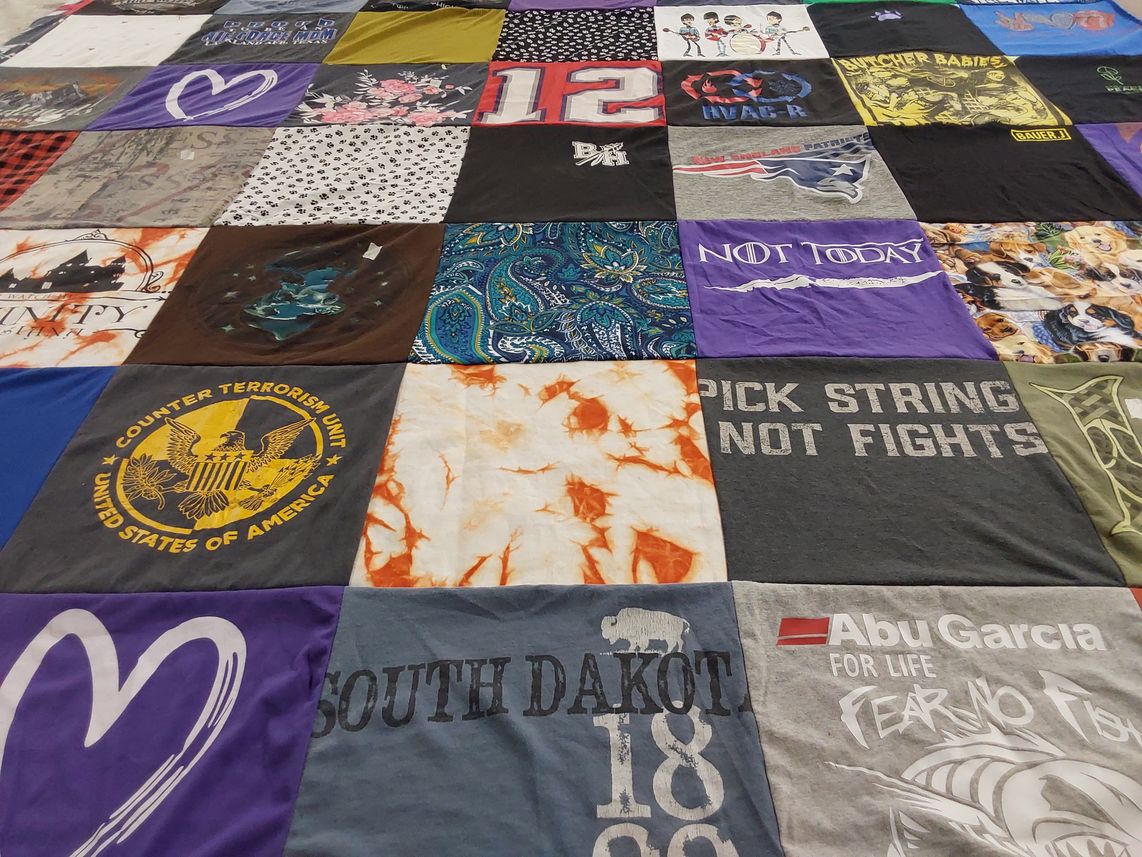 T-shirt quilt with fishing, counterterrorism themes by Lisa from TN