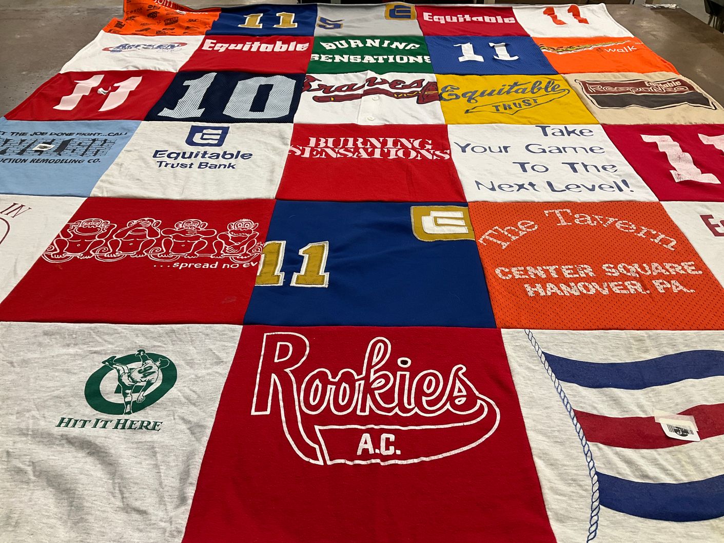 T-shirt quilt with sports, banking themes by ANDY from MD