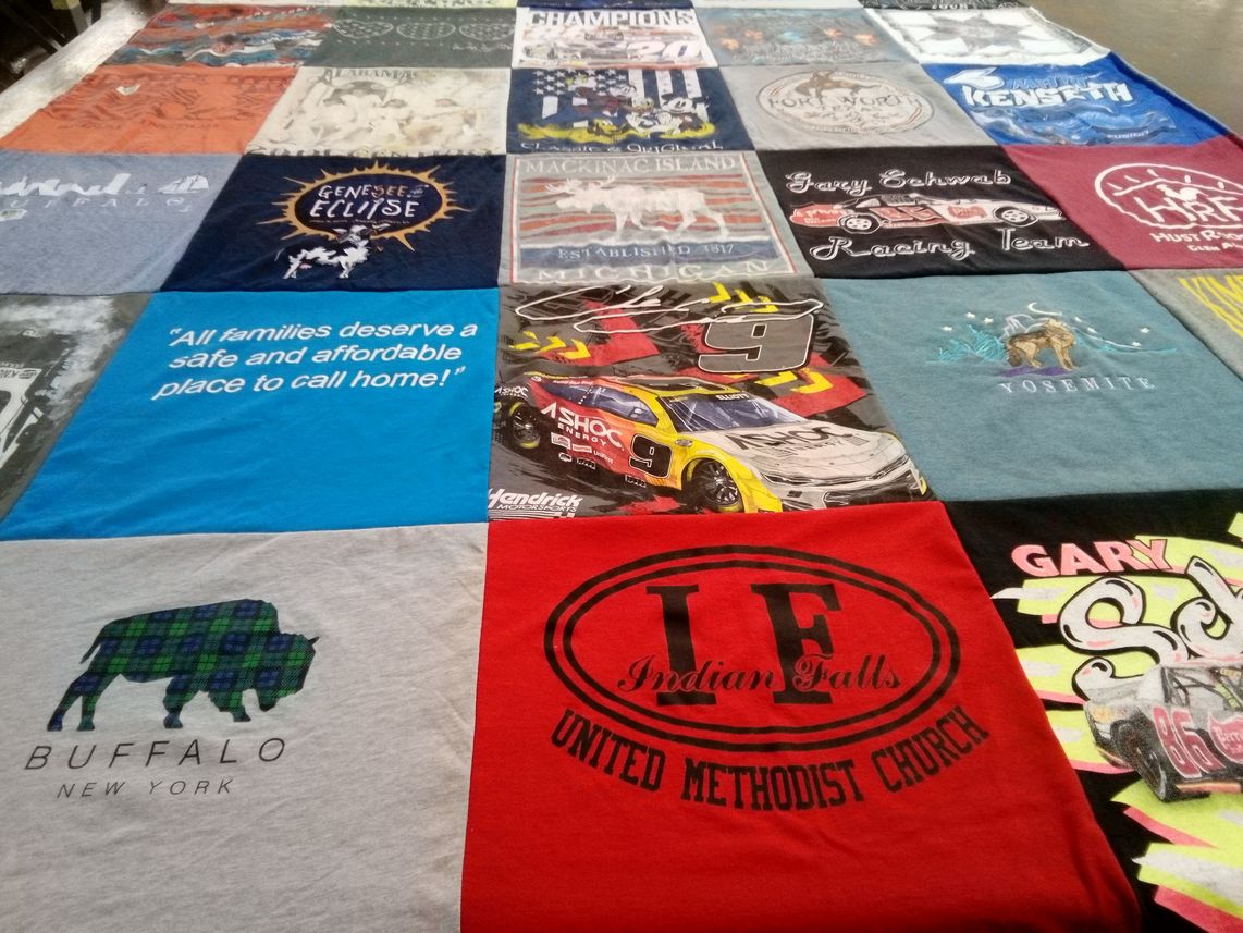 T-shirt quilt with community, advocacy themes by Kay from NY