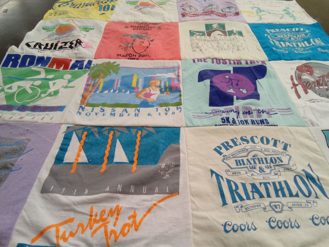 T-shirt quilt with running, sports themes by Carol from CA
