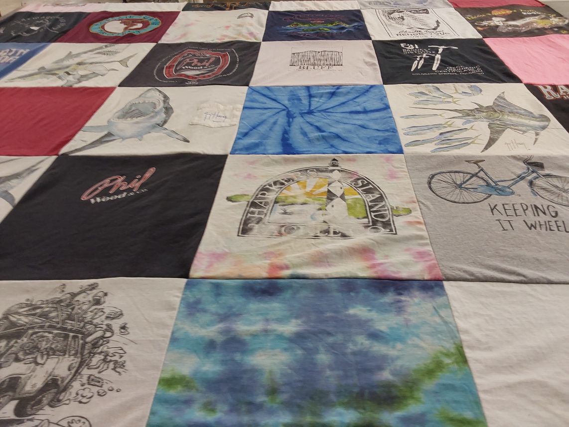 T-shirt quilt with fishing, bicycling themes by Ronald from NC