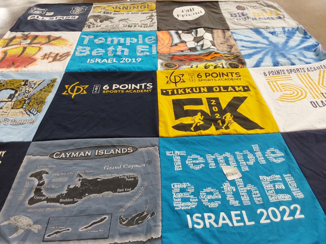 T-shirt quilt with sports, running themes by Lori from FL