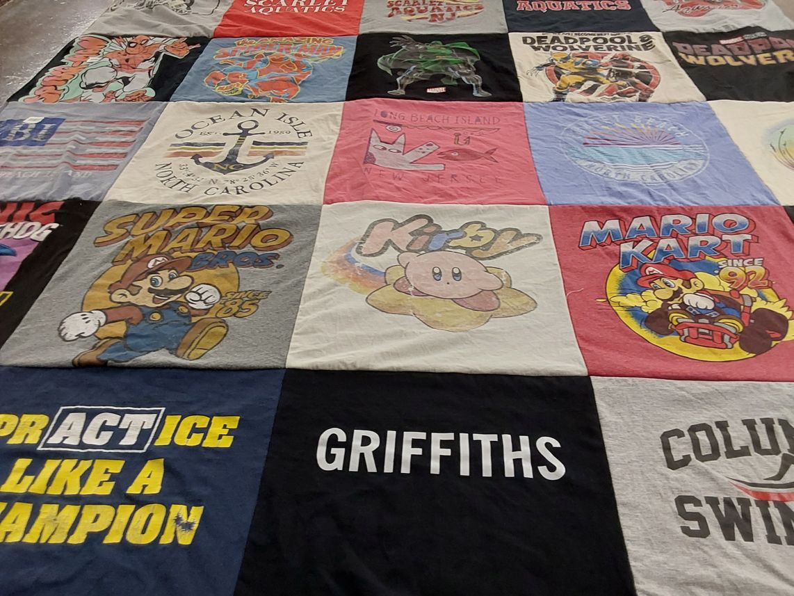 T-shirt quilt with gaming, swimming themes by Susan from NJ