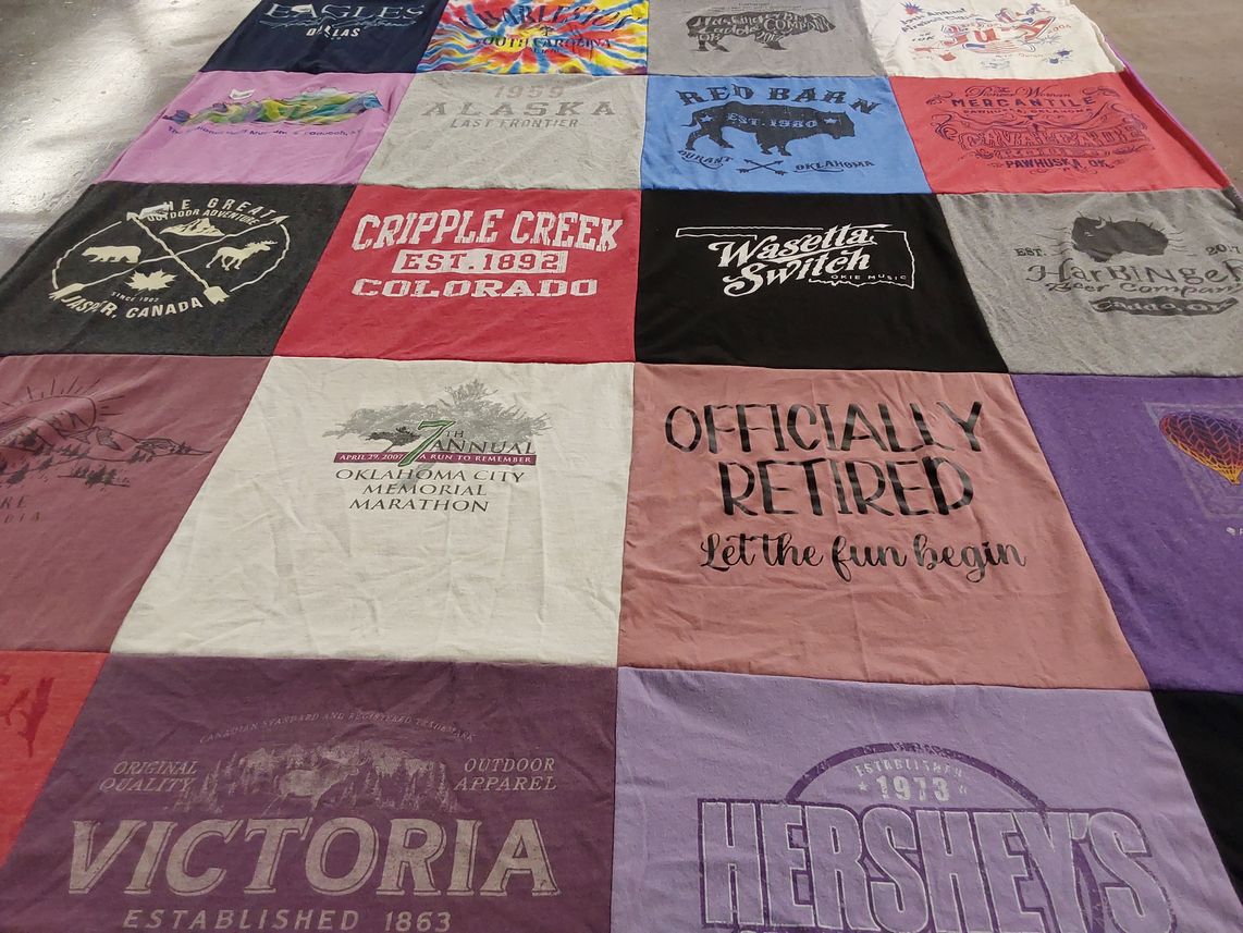 T-shirt quilt with travel, outdoor themes by Karla from OK
