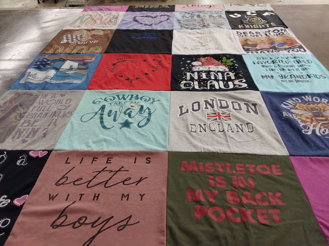 T-shirt quilt with family, travel themes by Diane from FL