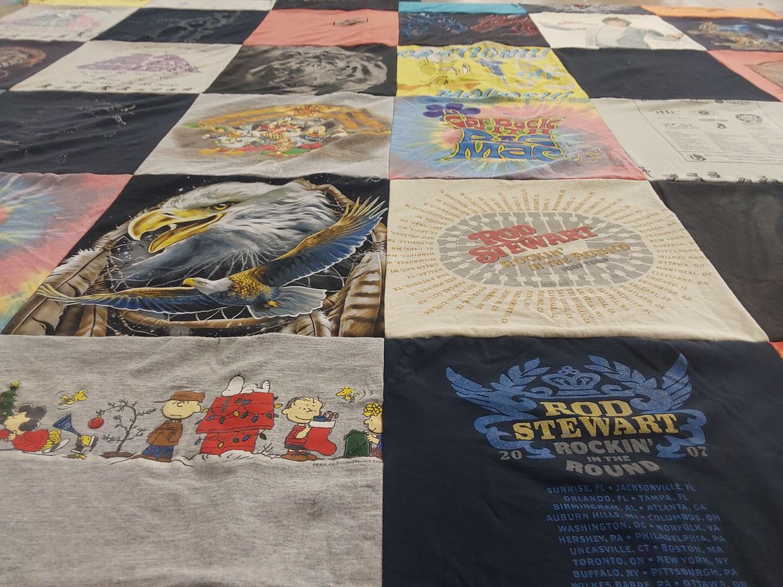 T-shirt quilt with music, cultural events themes by lauren from CA